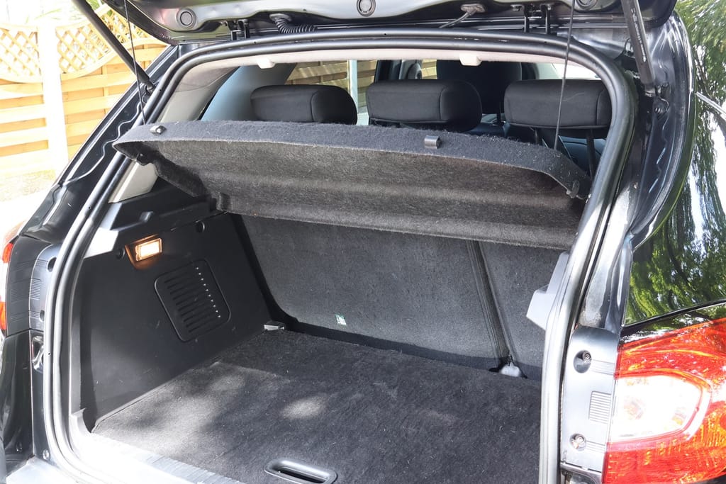 The same car boot after the interior detail, carpet extracted and lifted