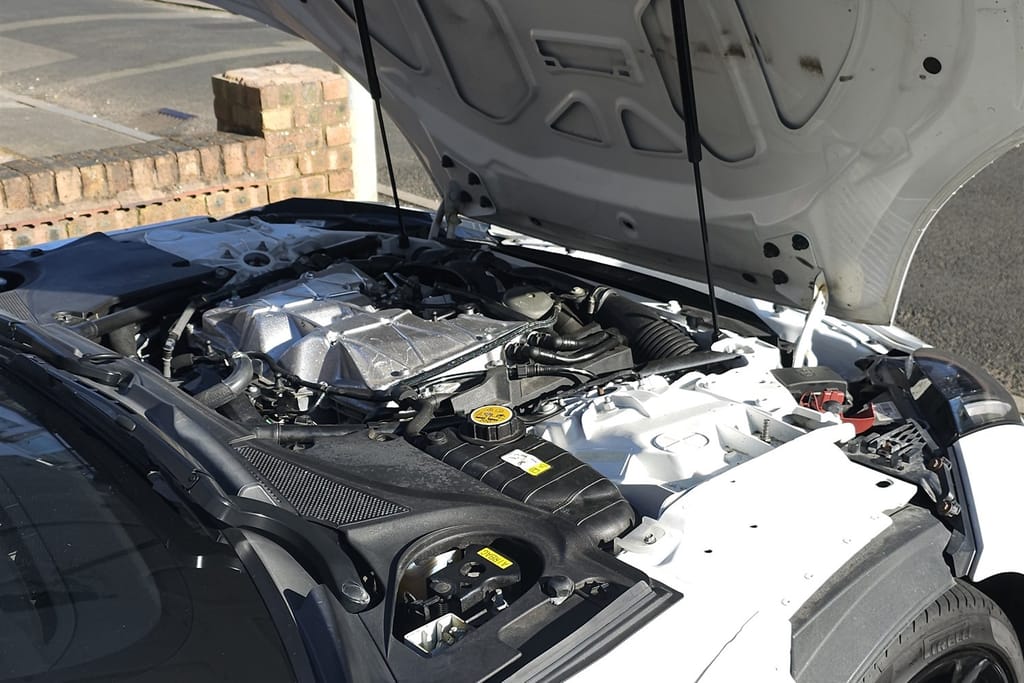 Jaguar engine bay before detailing