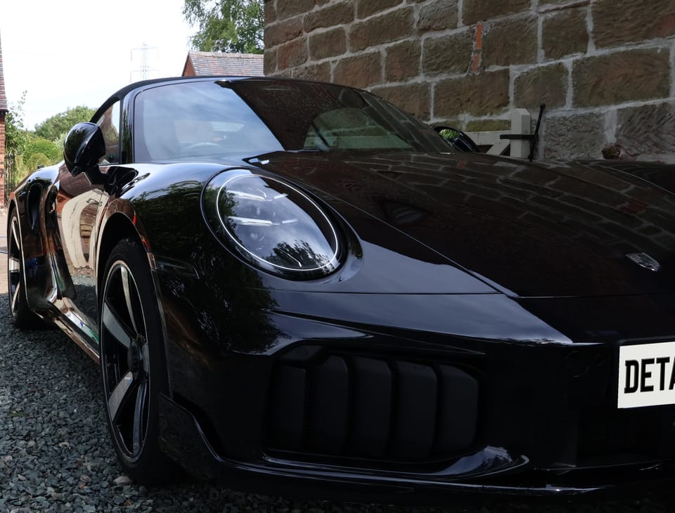 Black Porsche 911 Turbo photographed for a sale listing