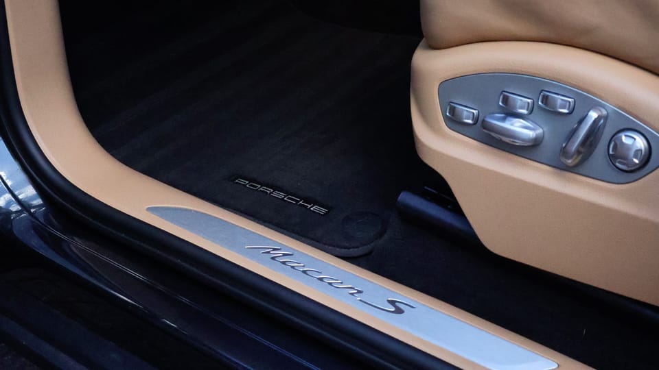 Car carpet being hot-water extracted before ozone odour treatment
