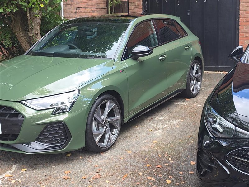 Green Audi A3 Sportback front three-quarter view after a maintenance valet