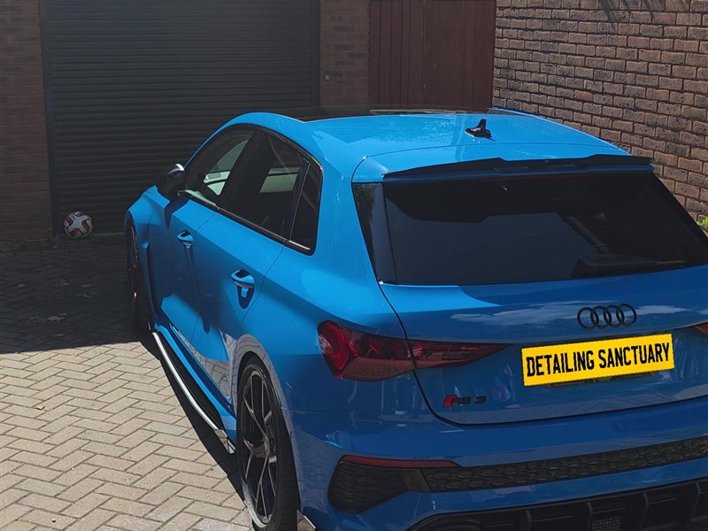 Blue Audi RS3 rear view on a driveway after a maintenance valet
