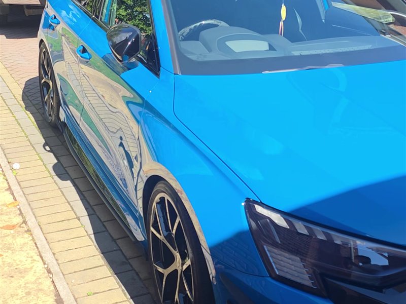 Blue Audi RS3 side profile after a maintenance valet