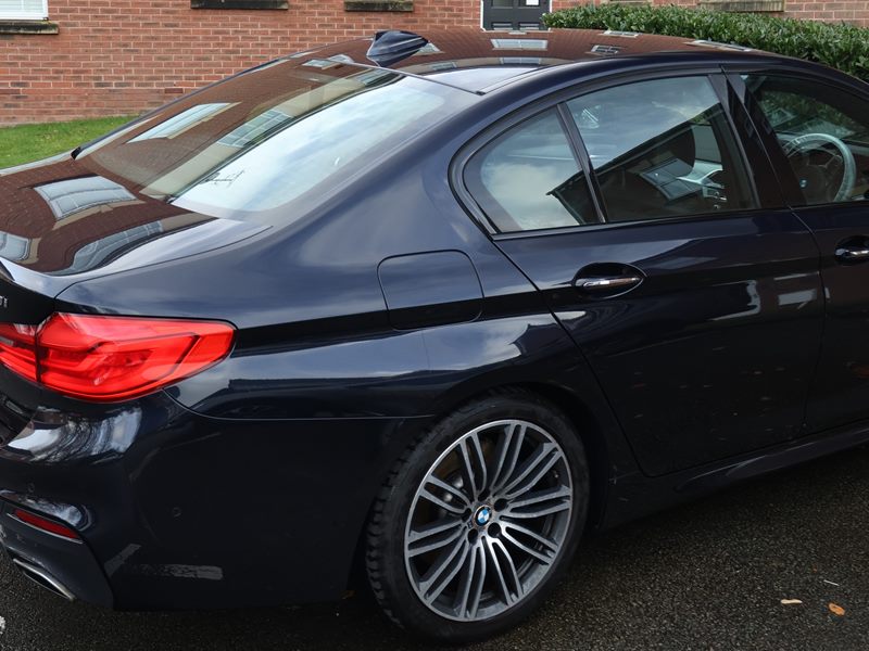 Black BMW 5 Series rear after a full detail