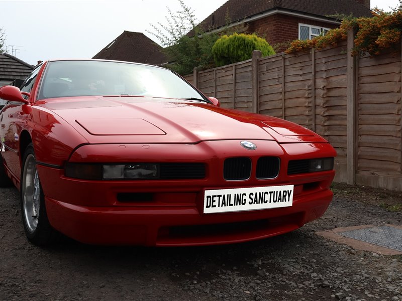 Red BMW 8 Series ceramic coated on a driveway in Wolverhampton