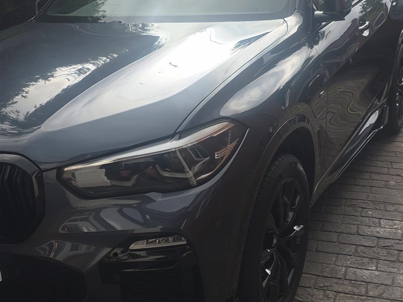 BMW X5 headlight and front grille after detailing
