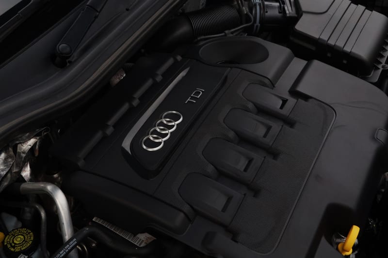 Audi TDI engine cover after cleaning, matt black and free of dust
