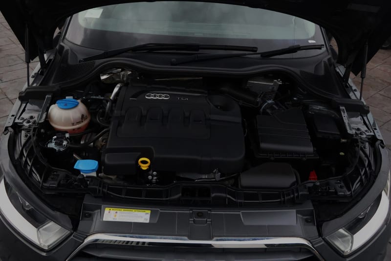 Audi engine bay after a full clean, wide view with the bonnet up