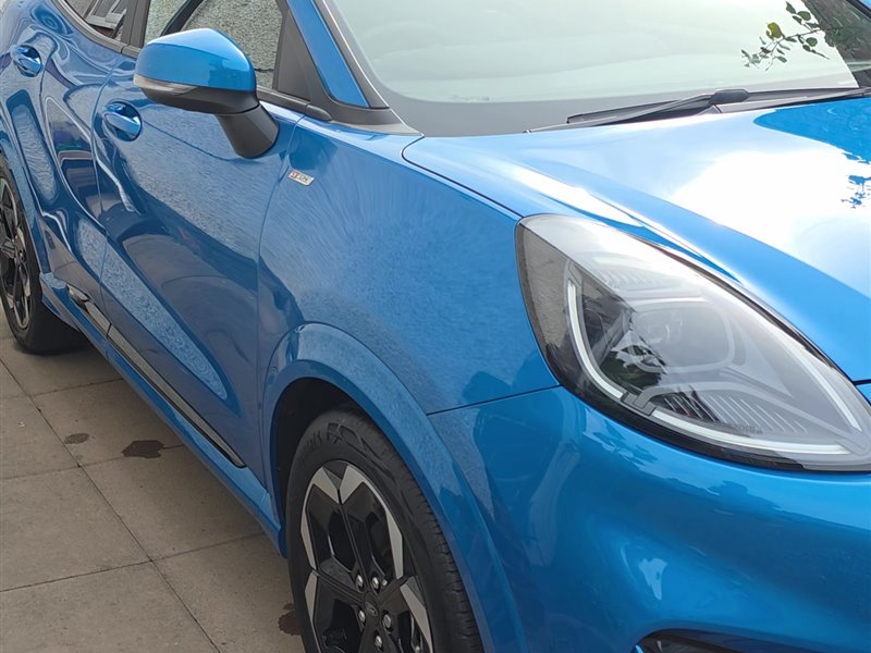 Blue Ford Puma ST-Line front three-quarter view after a ceramic coating
