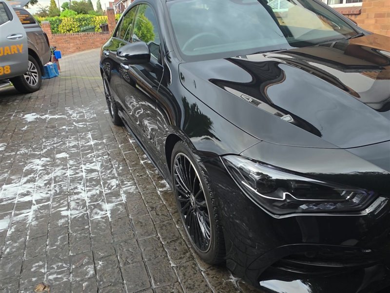 Black Mercedes CLA 200 front three-quarter view during a maintenance valet