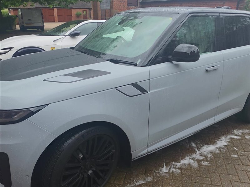 White Range Rover Sport front three-quarter view after a maintenance valet